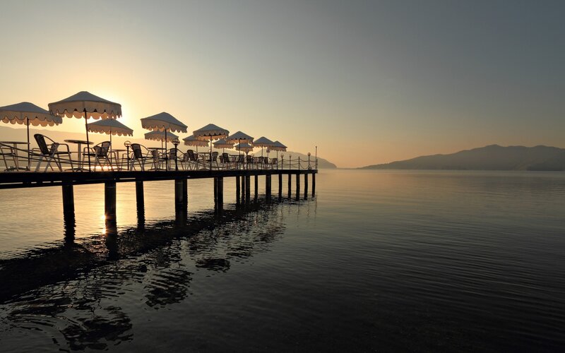 Pier with Umbrellas at Sunset — Orange