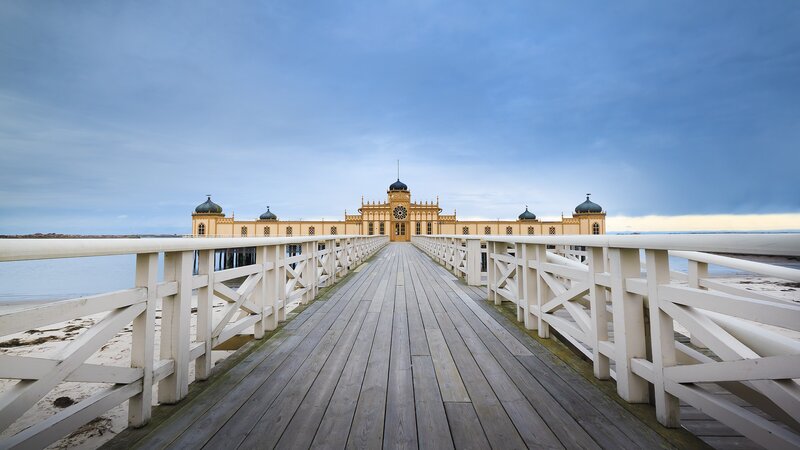 Pier with Yellow Building — Blue, Serene