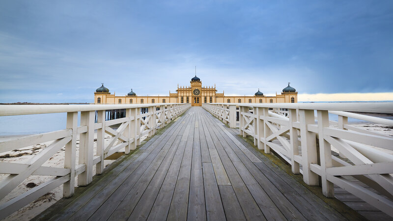 Pier with Yellow Building — Blue