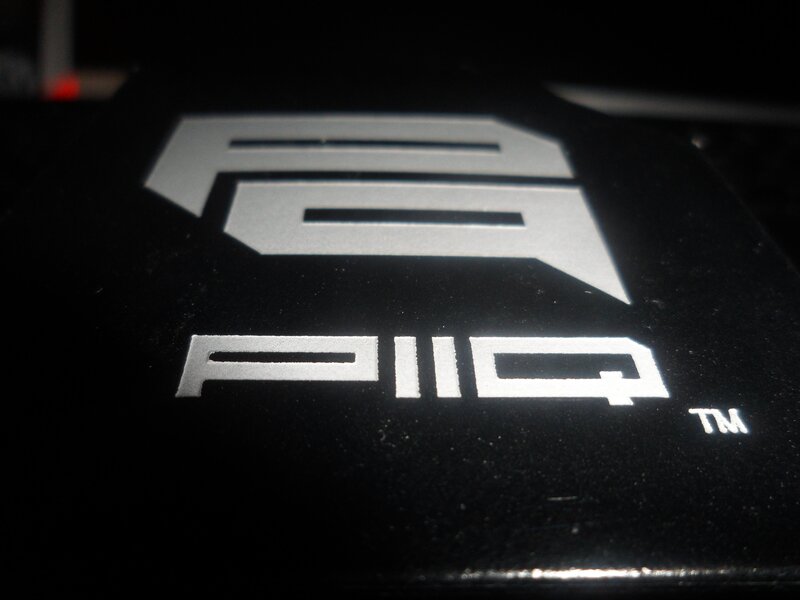 PIIQ logo on black surface