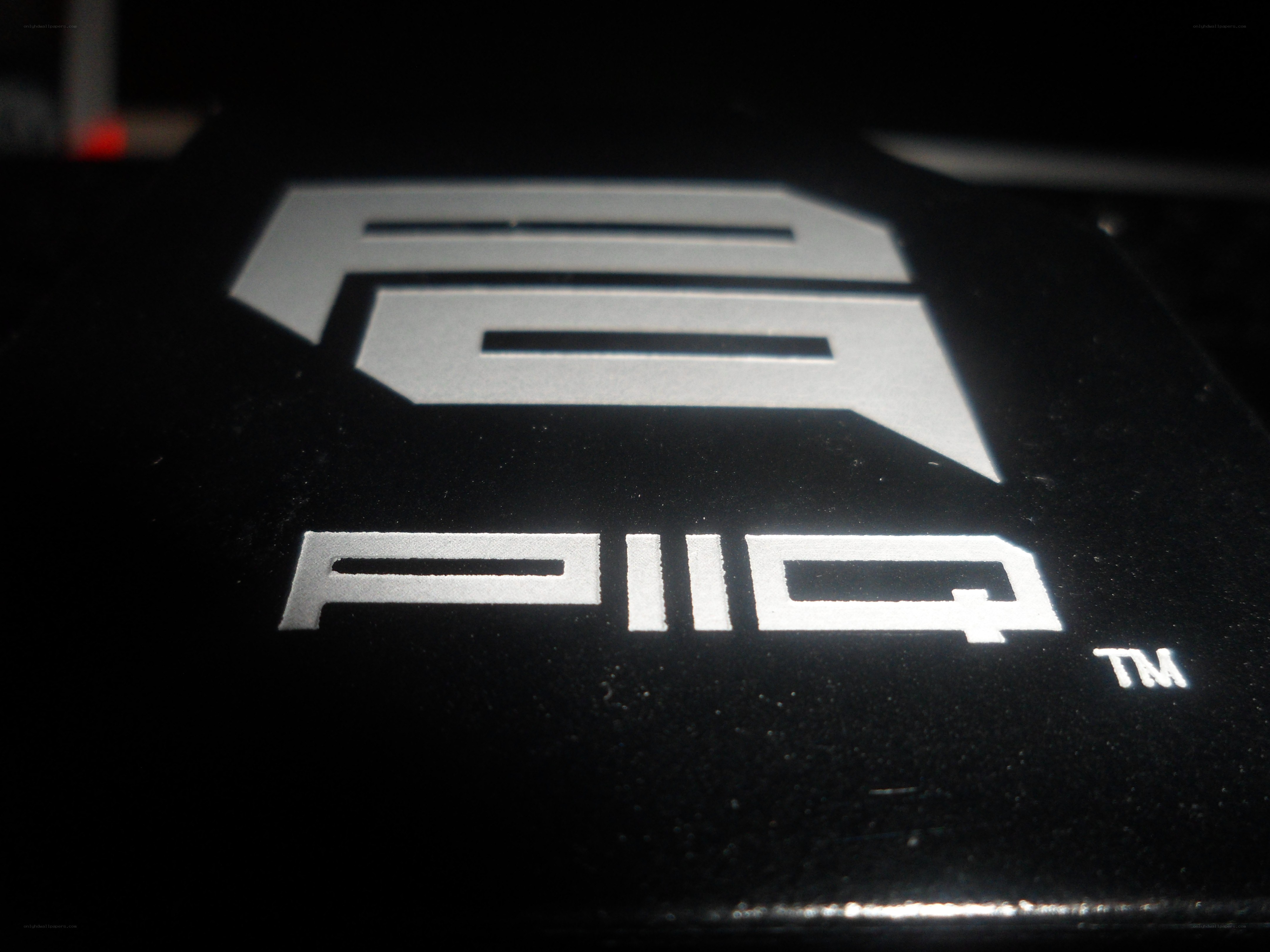 PIIQ logo on black surface