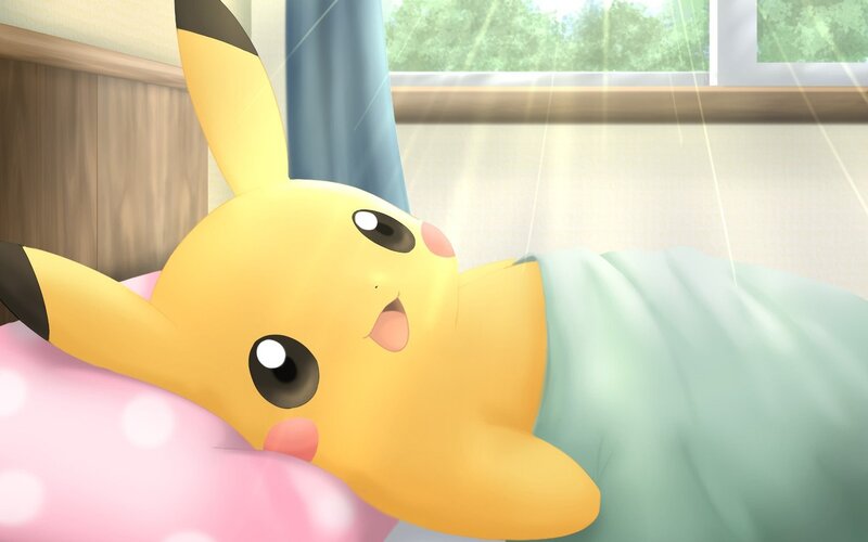 Pikachu sleeping in bed