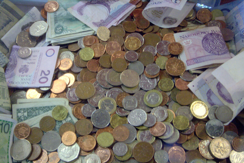pile of coins and banknotes