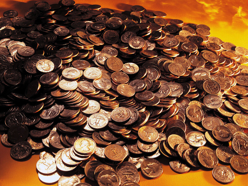pile of coins on golden surface