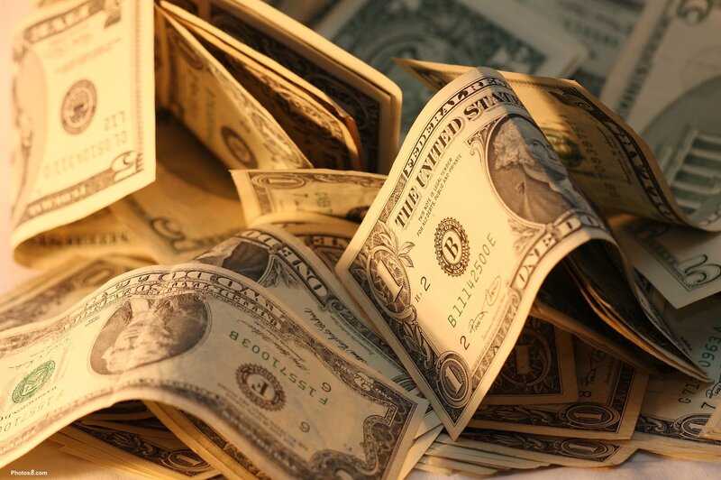pile of dollar bills