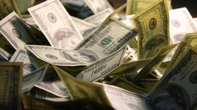pile of hundred-dollar bills