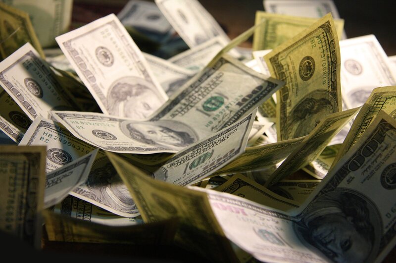 pile of hundred-dollar bills