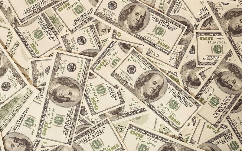 pile of hundred-dollar bills