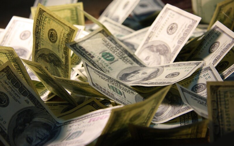 pile of hundred-dollar bills
