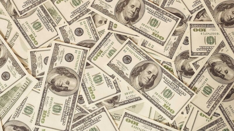 pile of hundred dollar bills