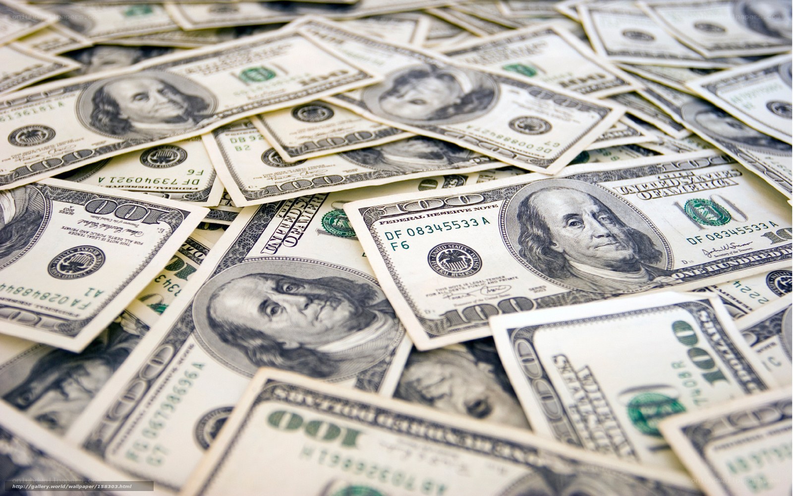 pile of hundred dollar bills
