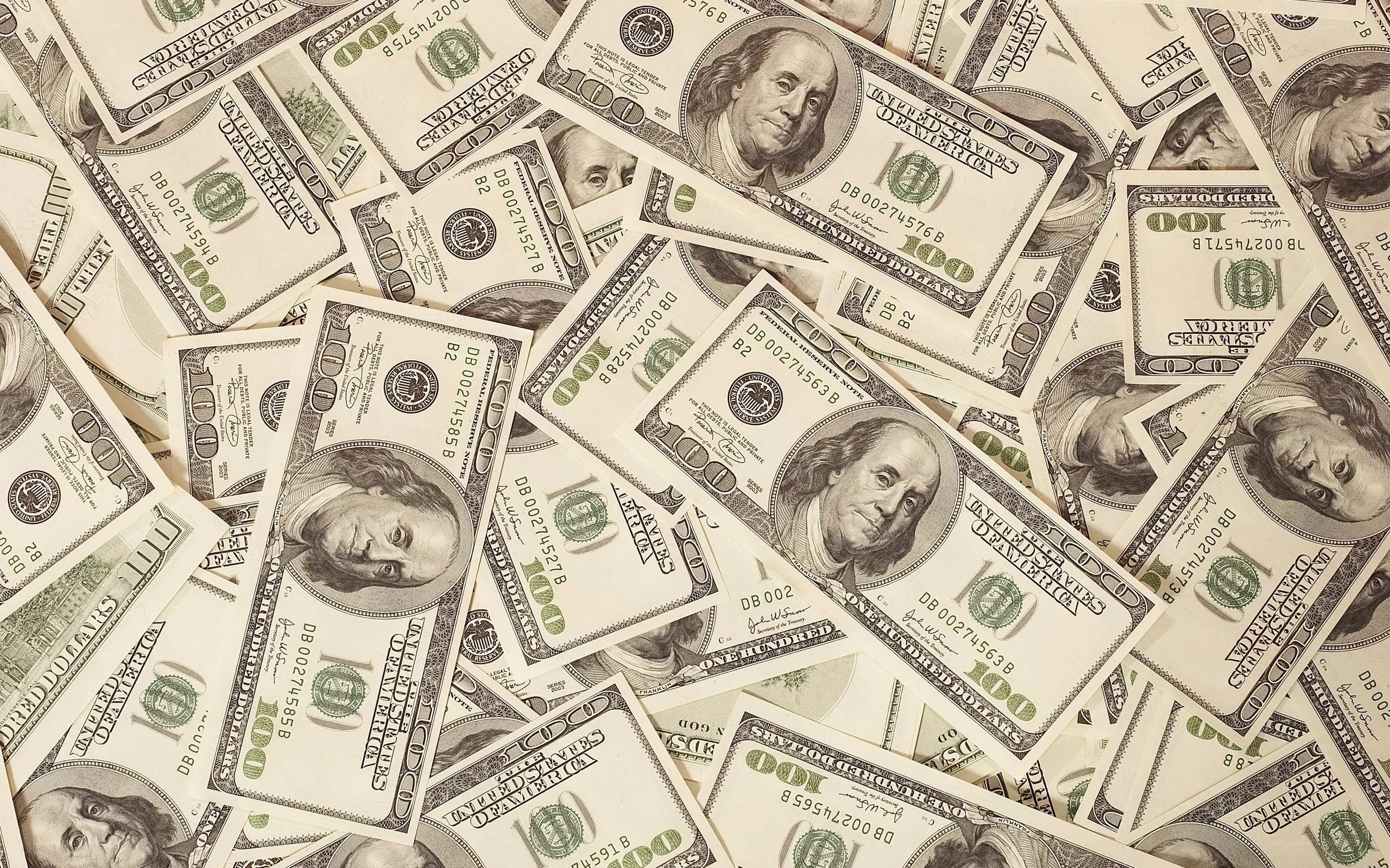 pile of hundred-dollar bills