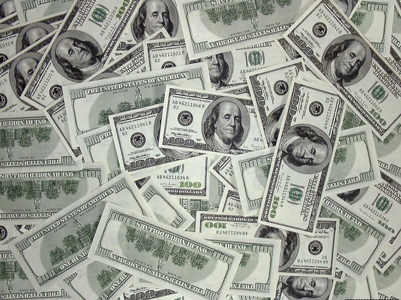 pile of hundred-dollar bills