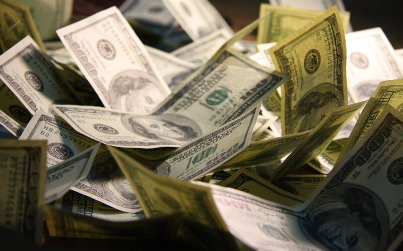 pile of hundred-dollar bills