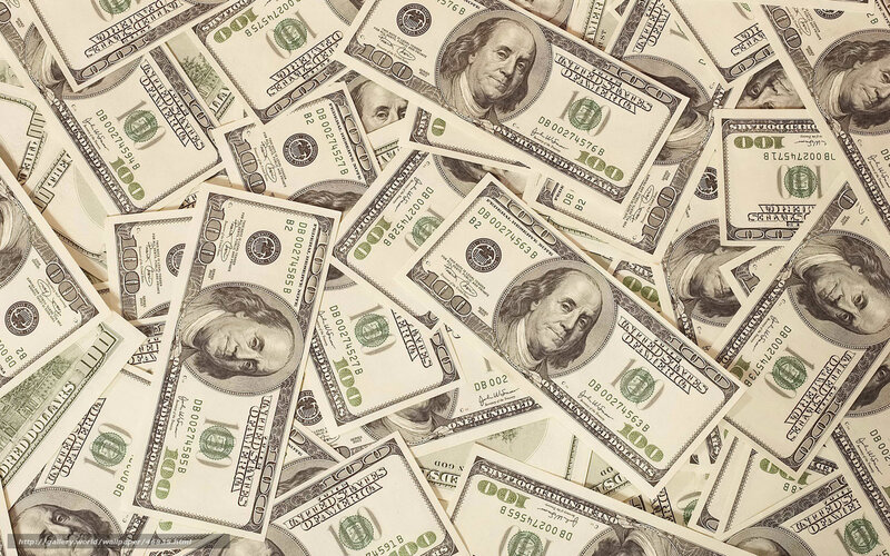 pile of hundred dollar bills