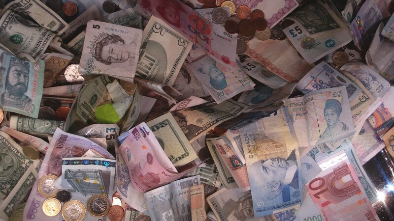 pile of international currency