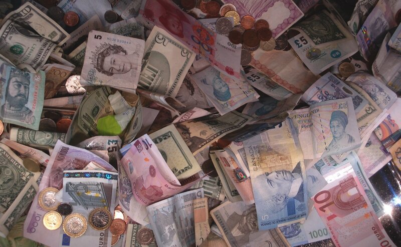 pile of international currency