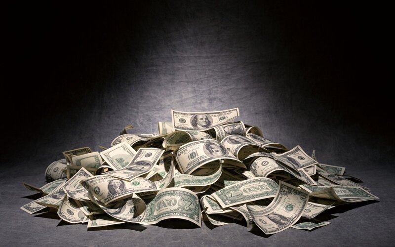 pile of US dollar bills