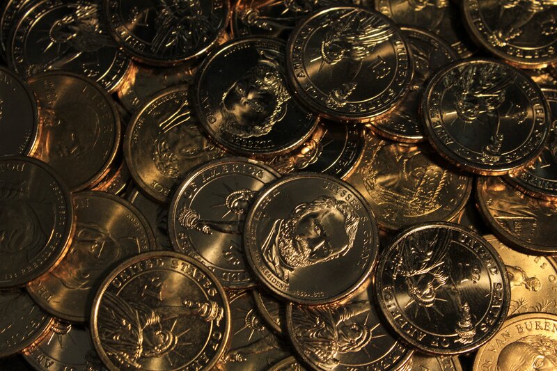 pile of US one-dollar coins