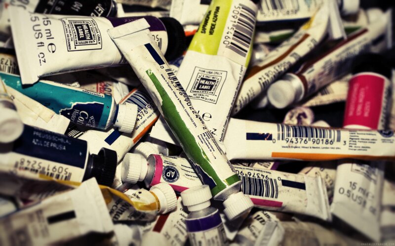 piles of used paint tubes