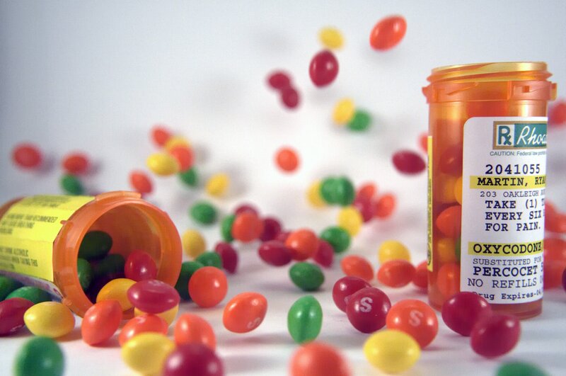 Pills and candy scattered on surface