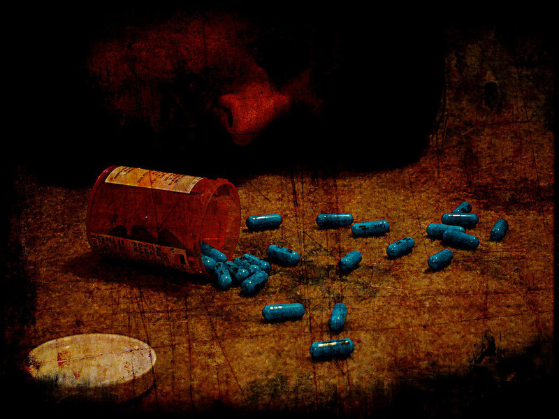 pills spilled on wooden surface