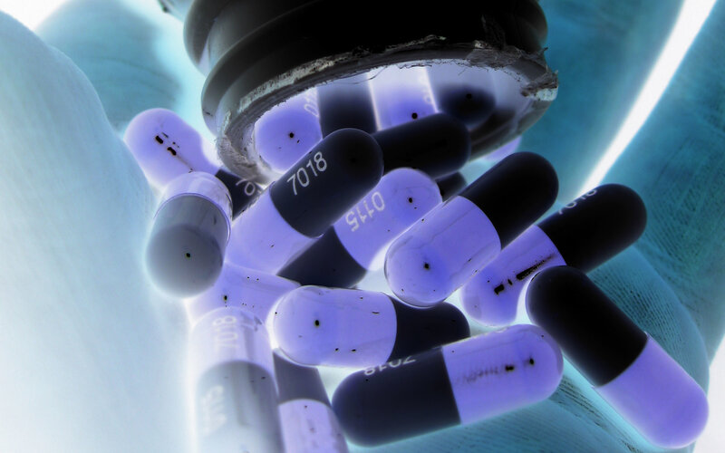 Pills spilling from a container