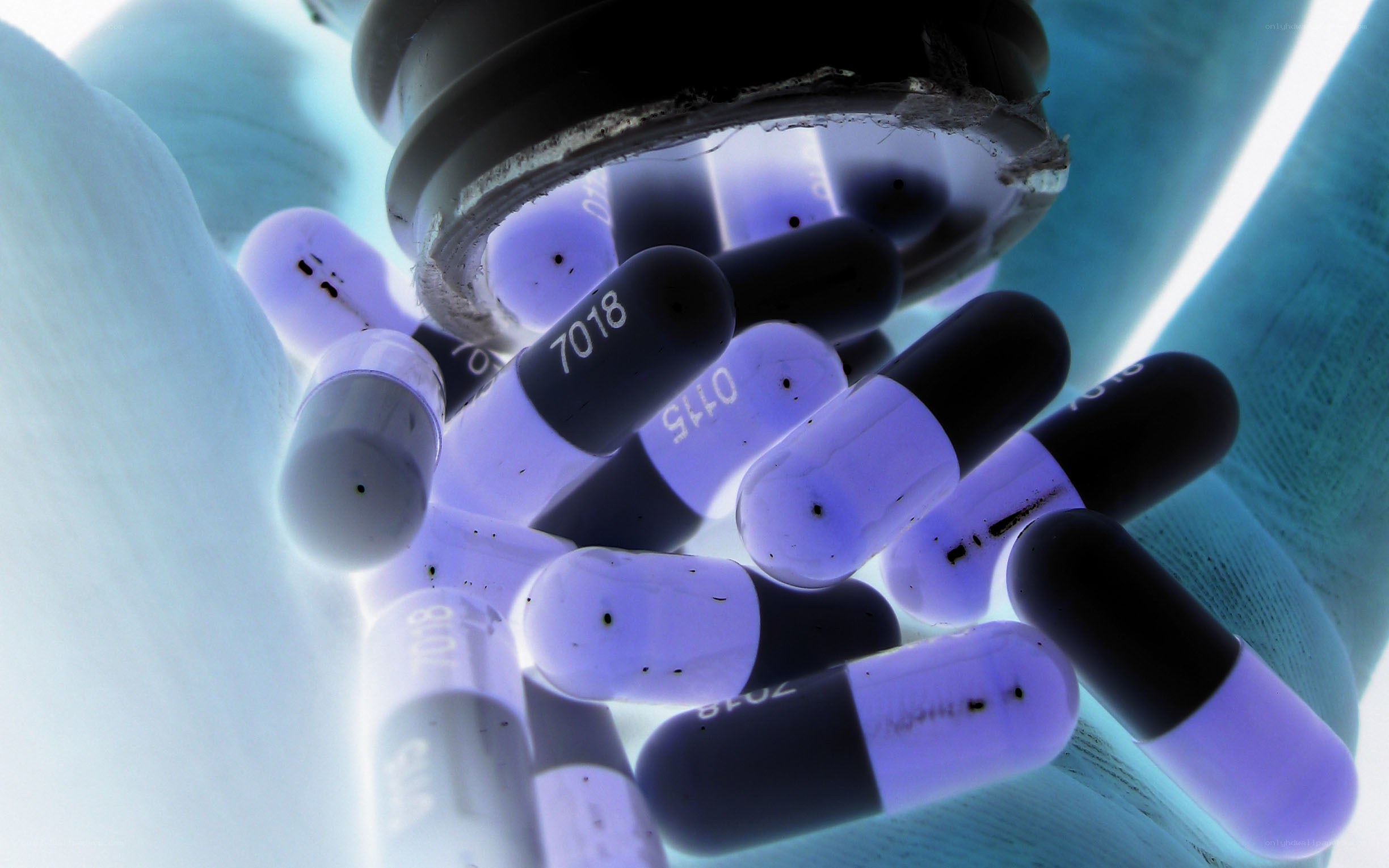 Pills spilling from a container