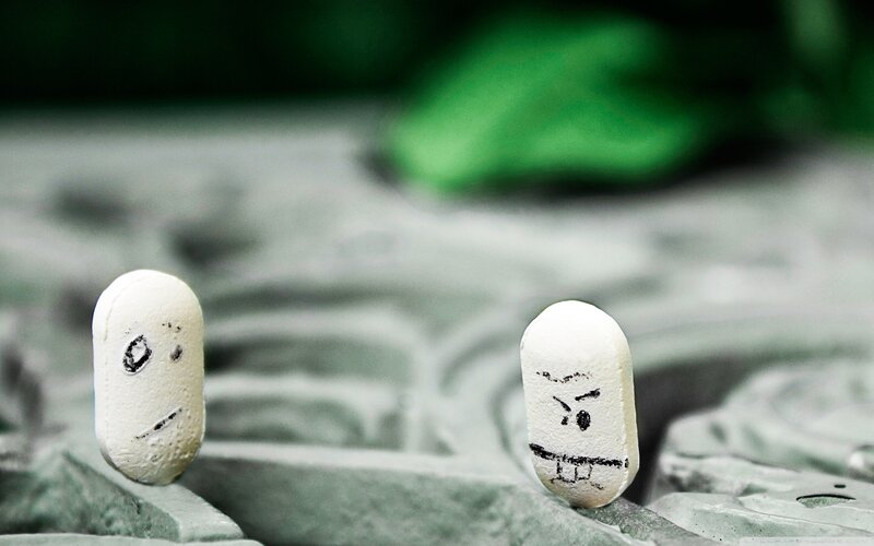 Pills with drawn faces