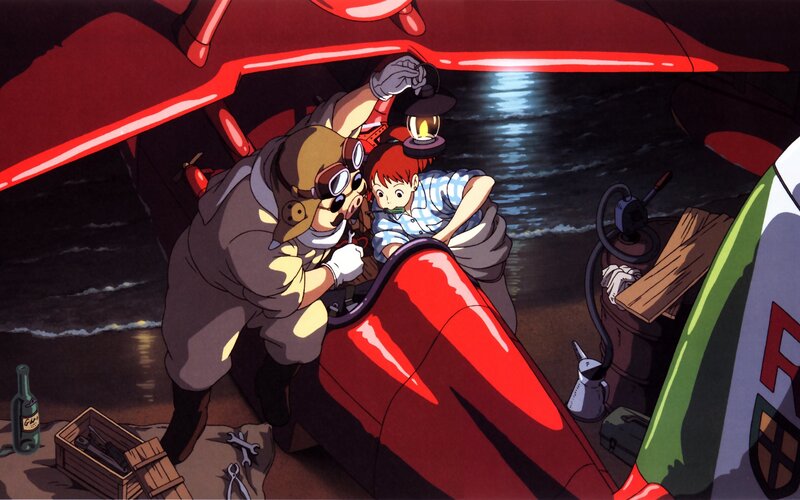 Pilot and child with red aircraft