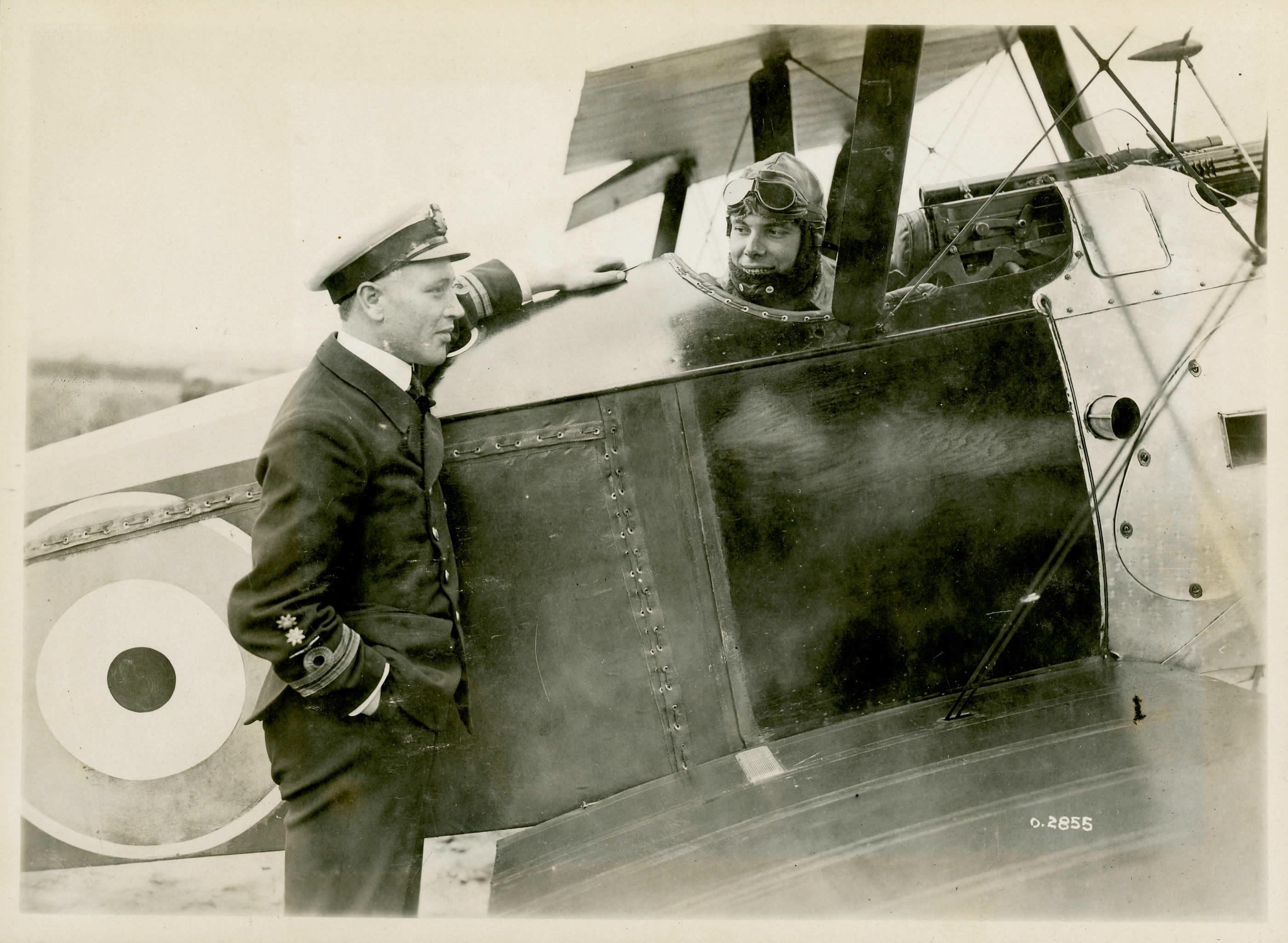 Pilot and officer by biplane