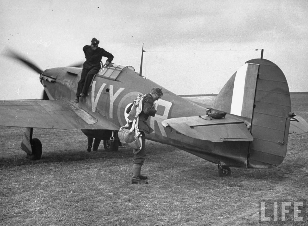 Pilot boarding a fighter plane