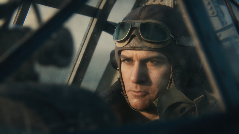 Pilot in Cockpit — Brown, Serious