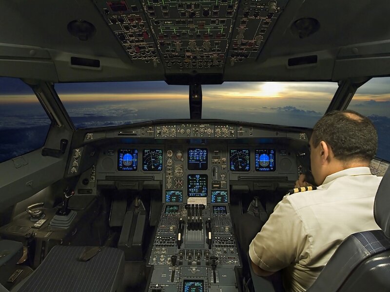 Pilot in Cockpit — Gray, Calm