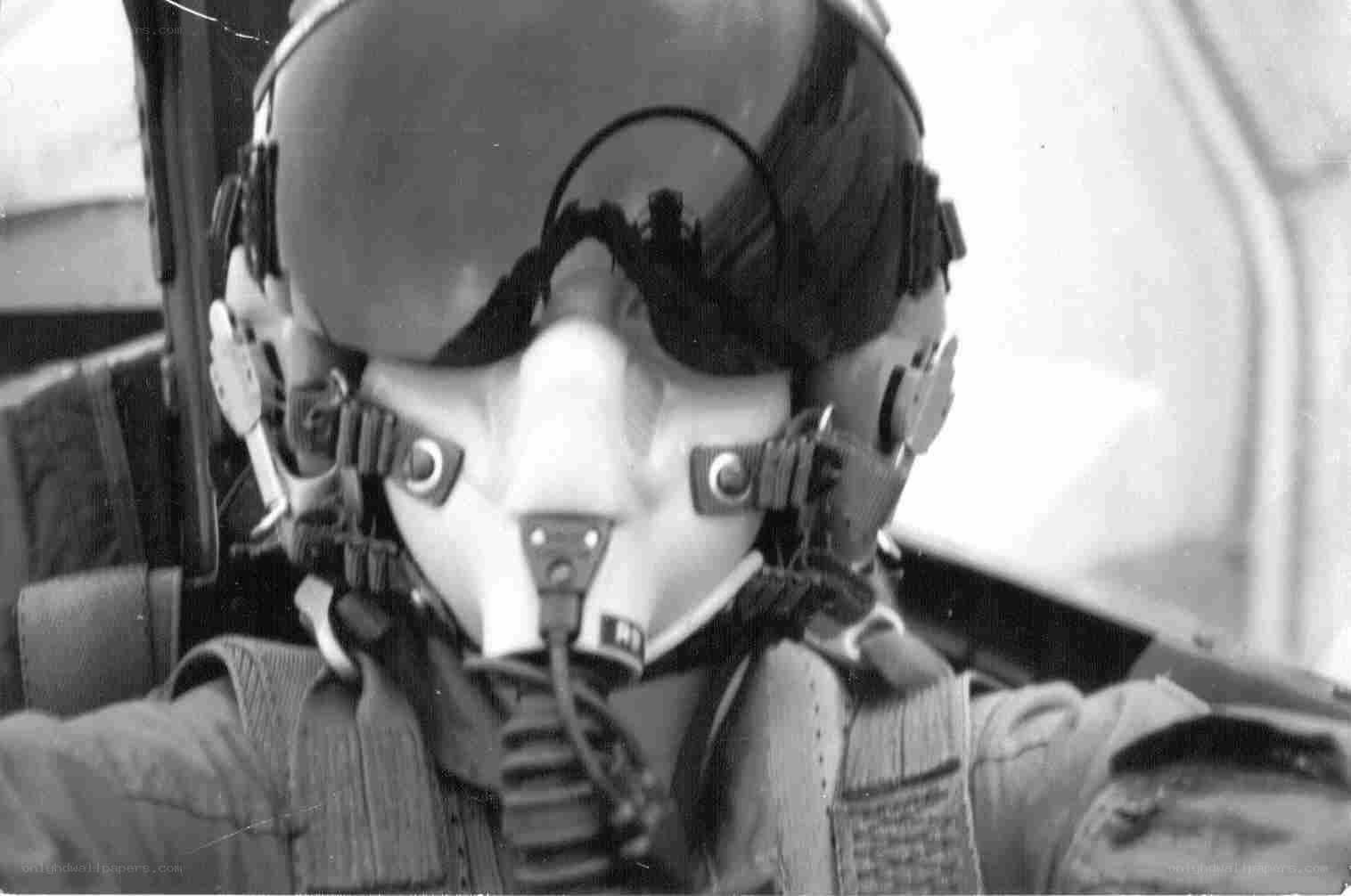 pilot in cockpit helmet