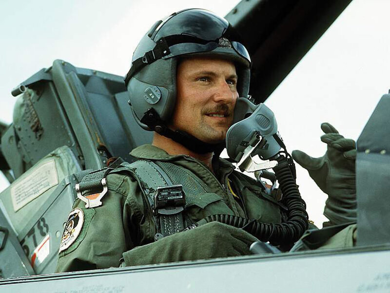 pilot in cockpit smiling