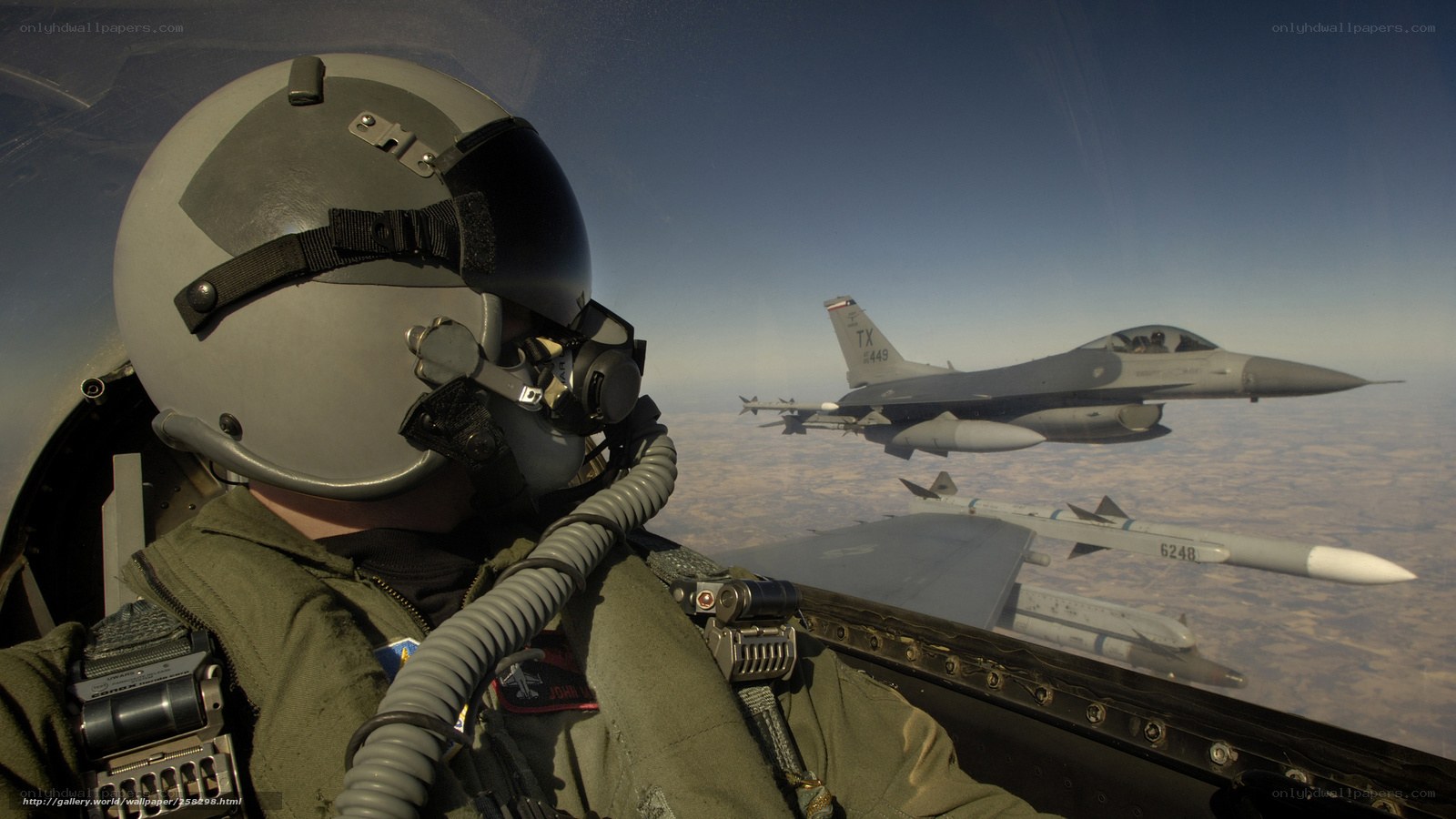 Pilot in cockpit with fighter jet