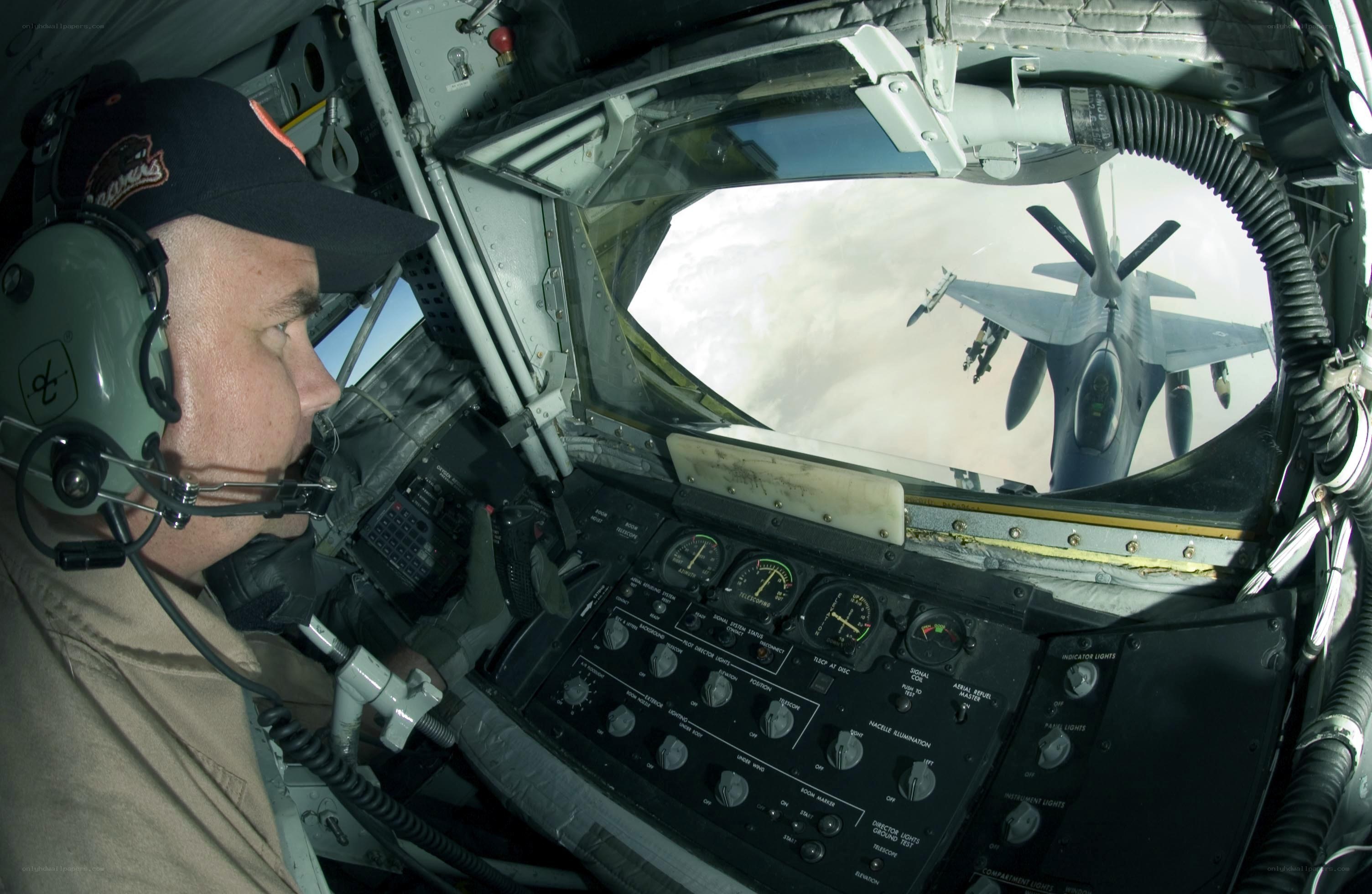 Pilot in cockpit with fighter jet