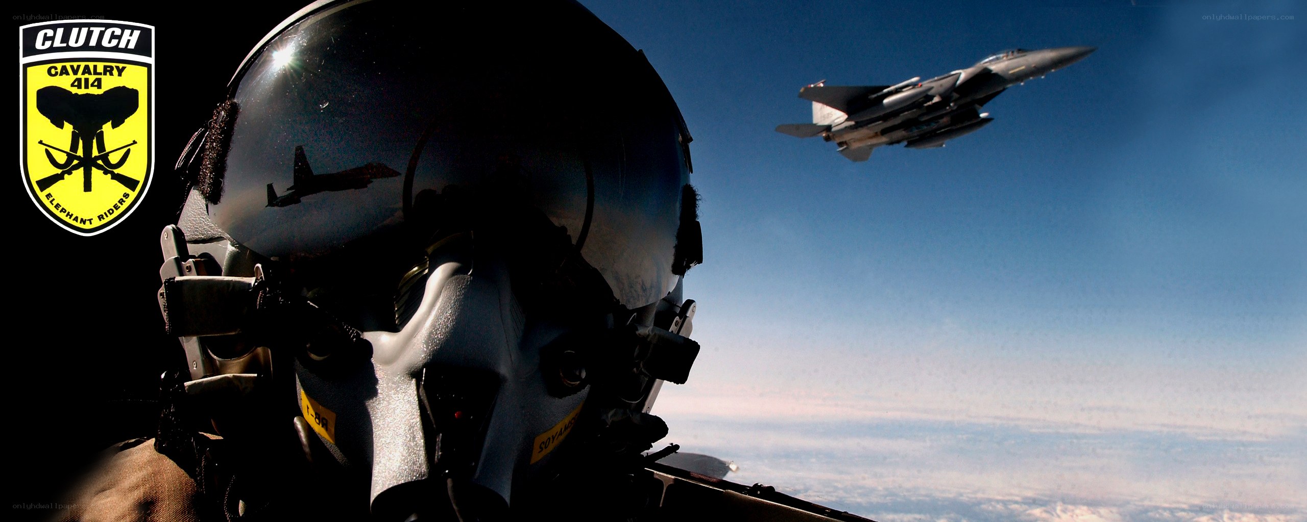 Pilot in cockpit with fighter jet