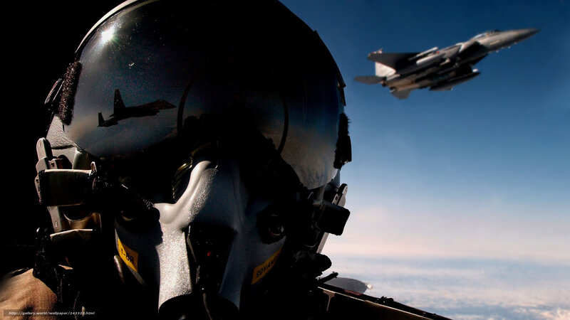 Pilot in cockpit with fighter jet
