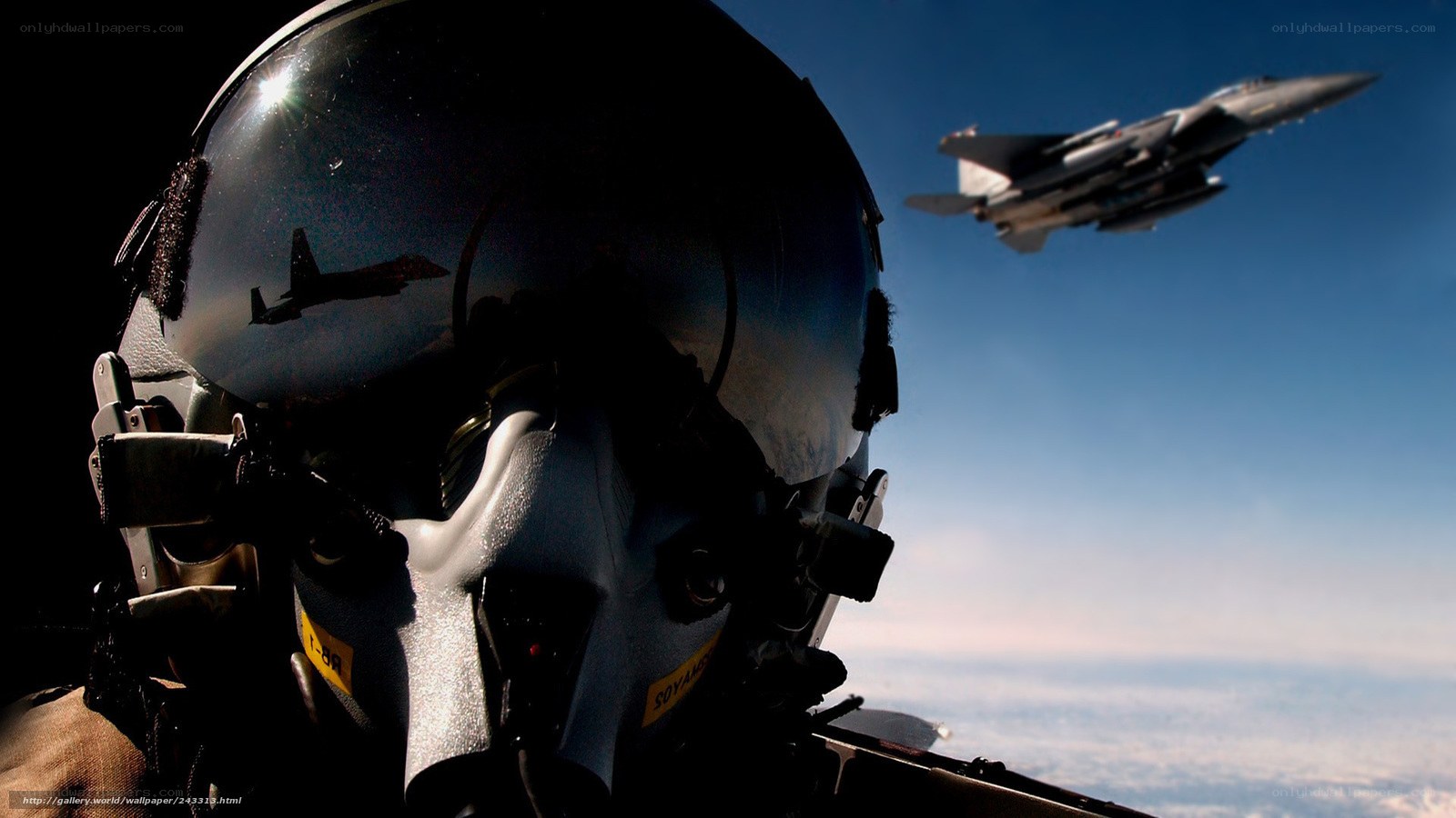 Pilot in cockpit with fighter jet