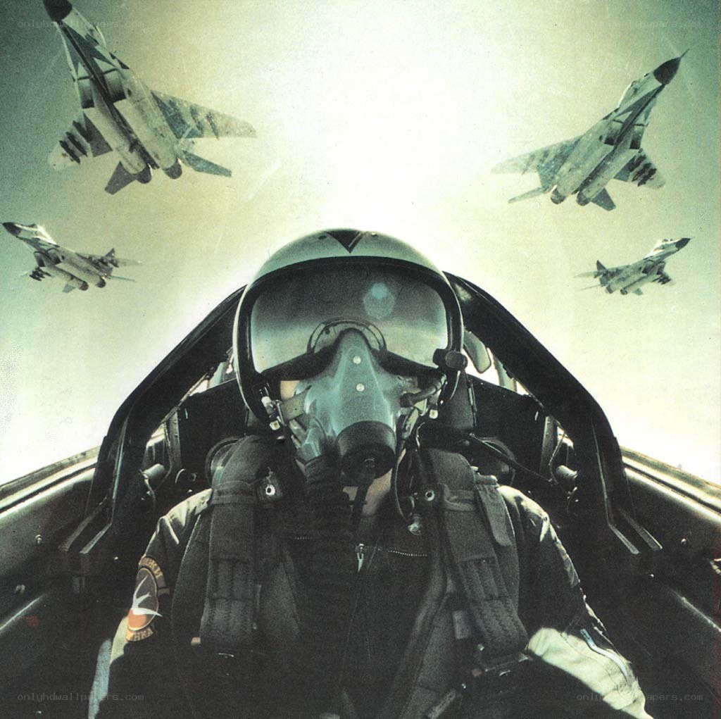 Pilot in cockpit with fighter jets
