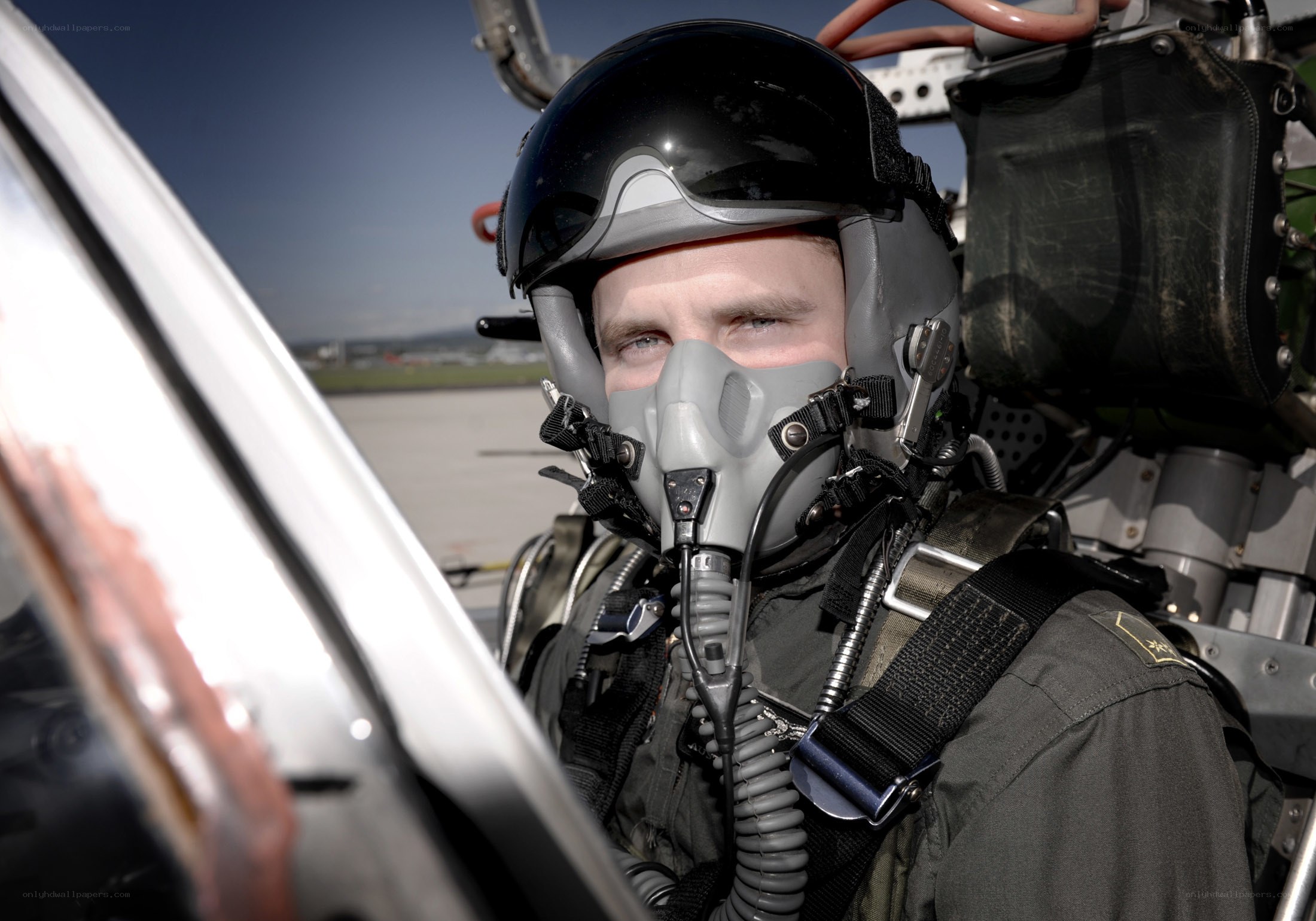 pilot in cockpit with helmet