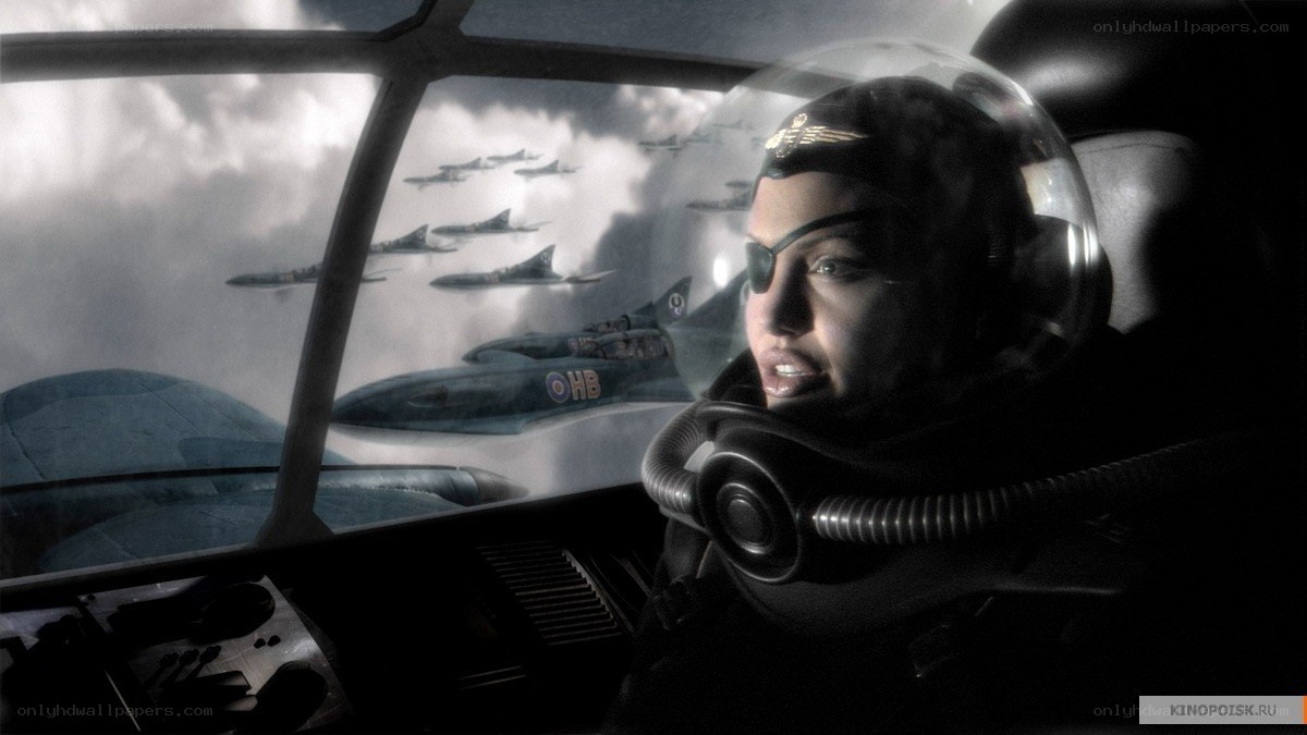 pilot in cockpit with jet formation