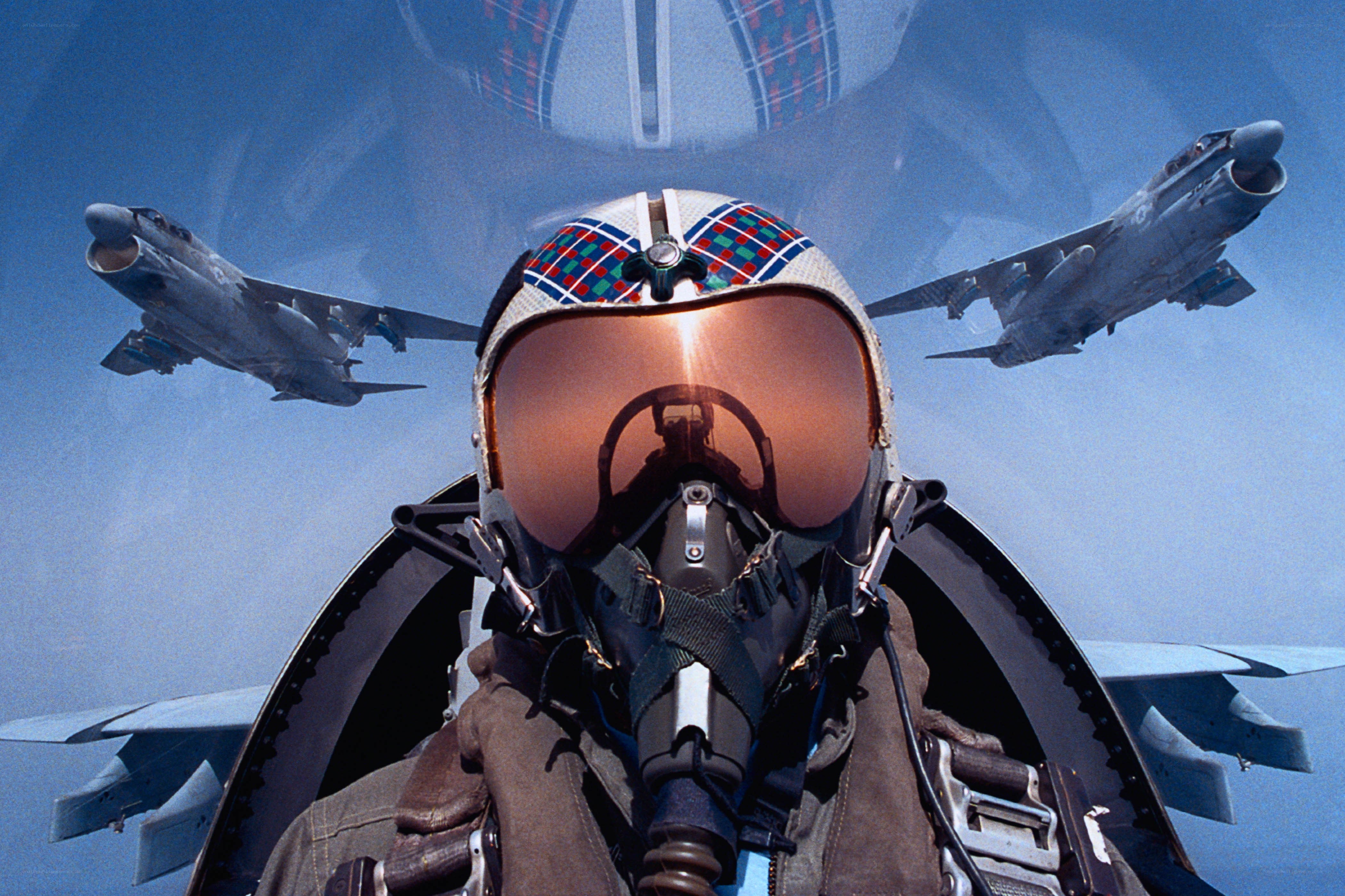 Pilot in cockpit with jets