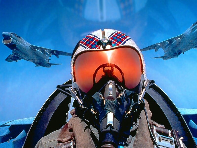 Pilot in cockpit with jets