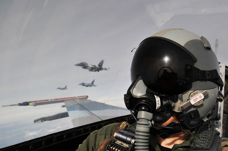 Pilot in cockpit with jets