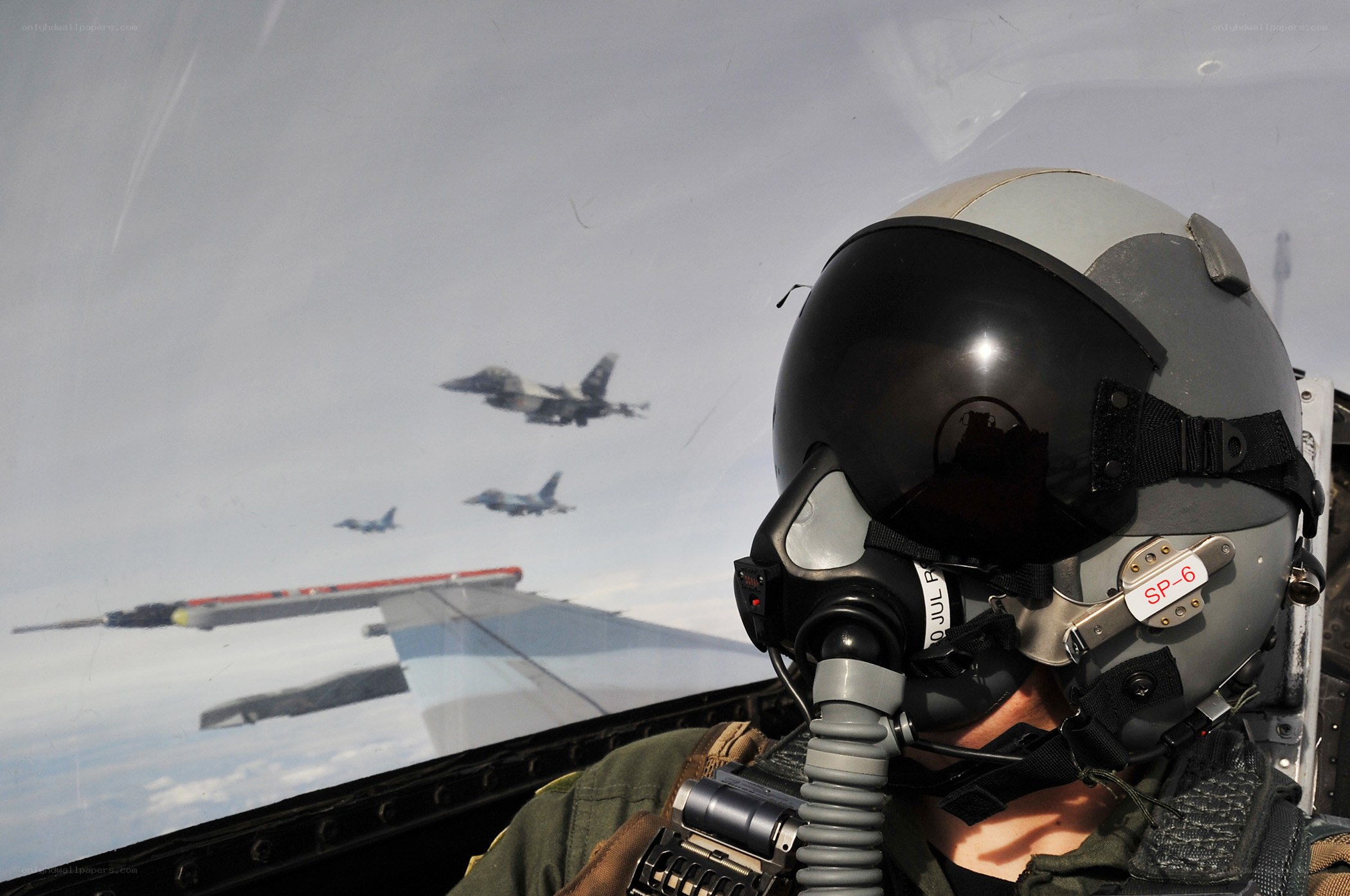 Pilot in cockpit with jets