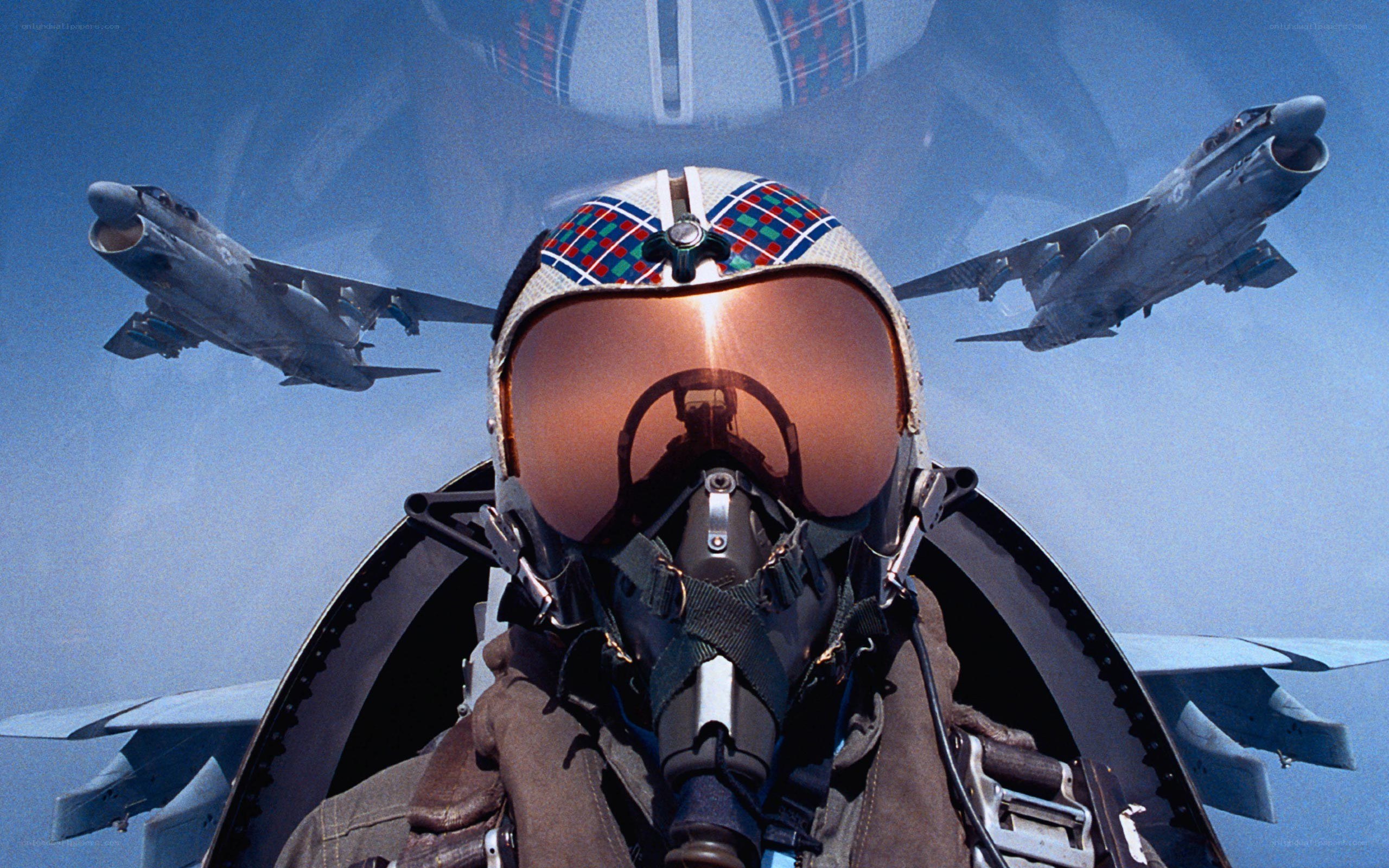 Pilot in cockpit with jets