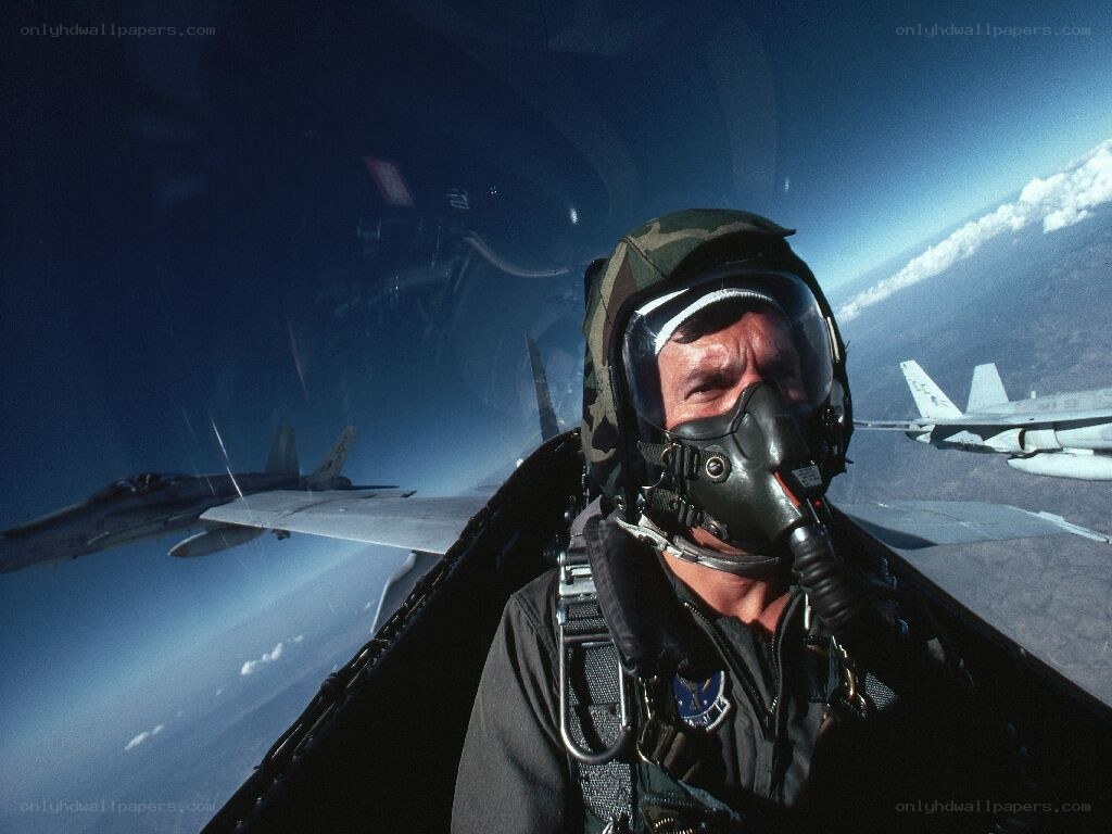 Pilot in cockpit with jets